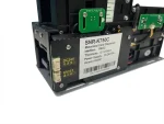 Close-up of the SNR-K750C motorized card dispenser side panel, showing the DC24V power input and RS232 communication port labels.