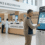 Patient using hospital check-in kiosk printing wristband and receipt